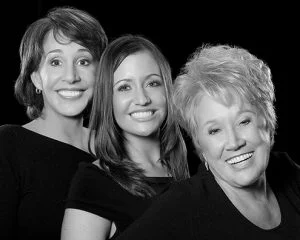 black and white image of three women smiling